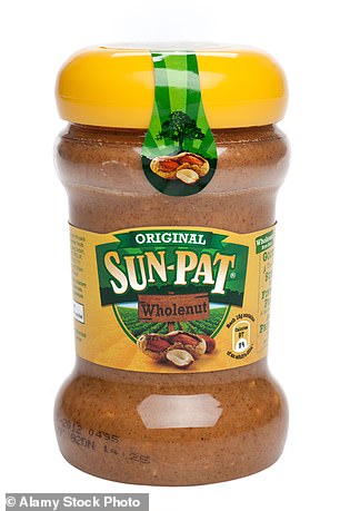 Serve hot, over rice or noodles, or with bread to help soak up the sauce. A peanut butter jar is seen above